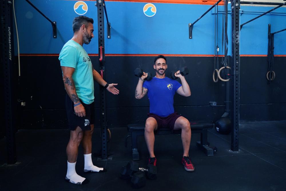 Álvaro con su entrenador